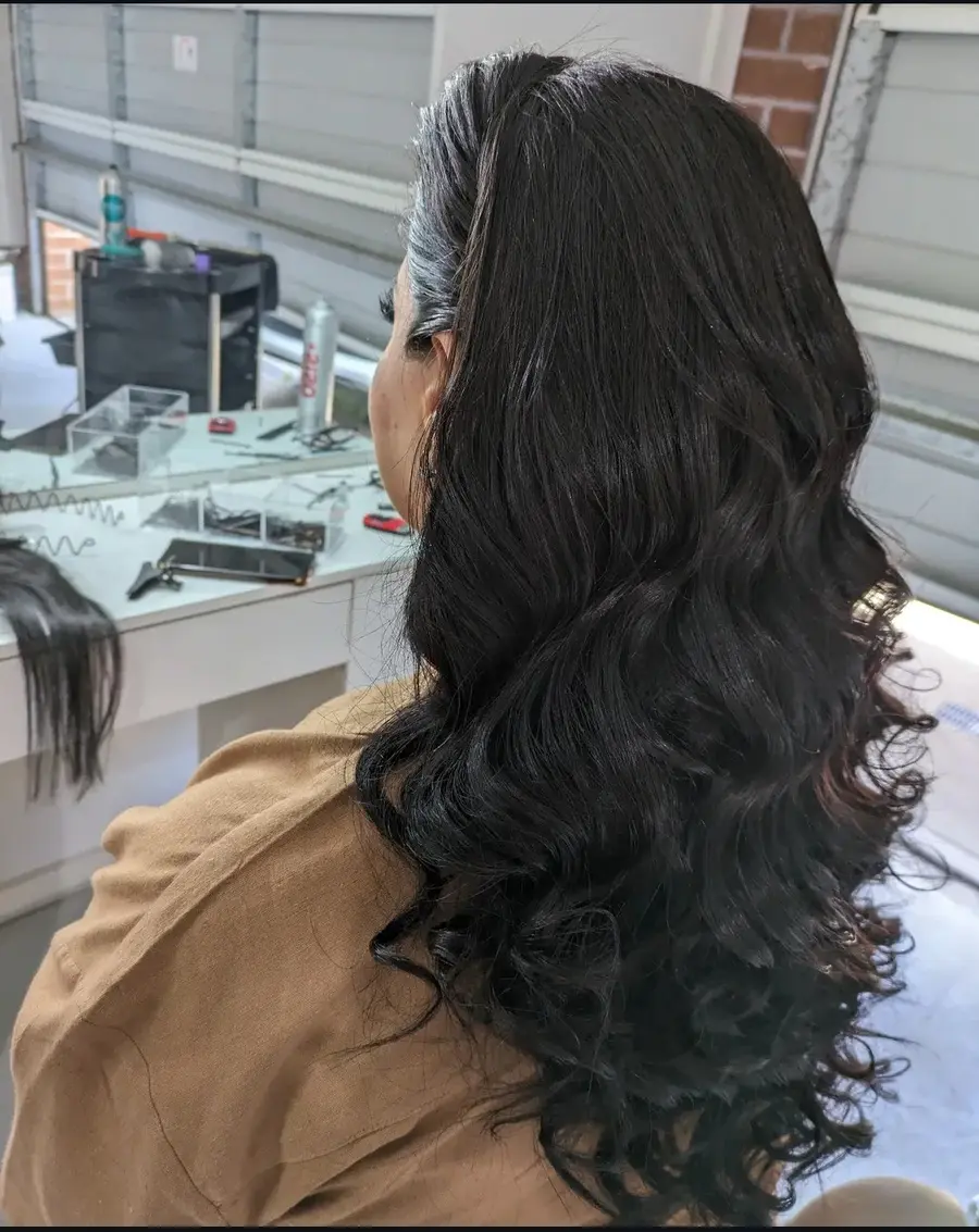 Glossy black waves styled for a mobile salon client